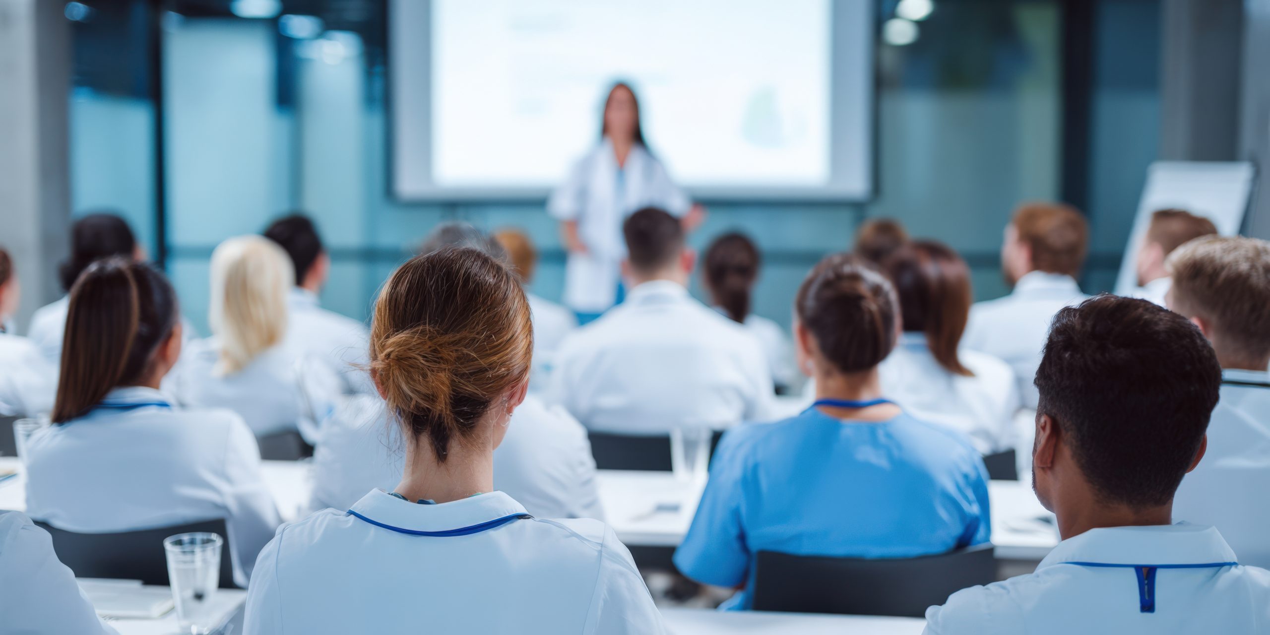 Nurses attending a continuing education presentation.
